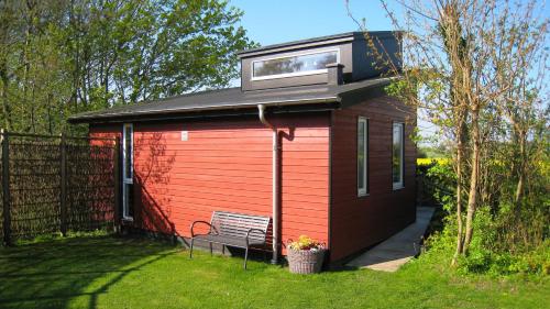 a tiny house with a window on top of it at Ølholm Cottage in Stege