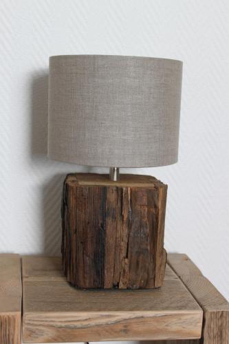 a lamp sitting on top of a wooden table at Hotel Fresena in Baltrum