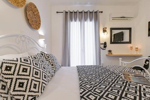 En eller flere senge i et værelse på Casa Verde Di Naxos