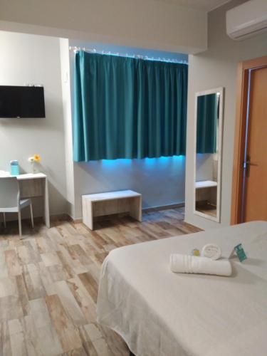 a hotel room with a bed and a large window at Te Maná Hotel in Torreblanca