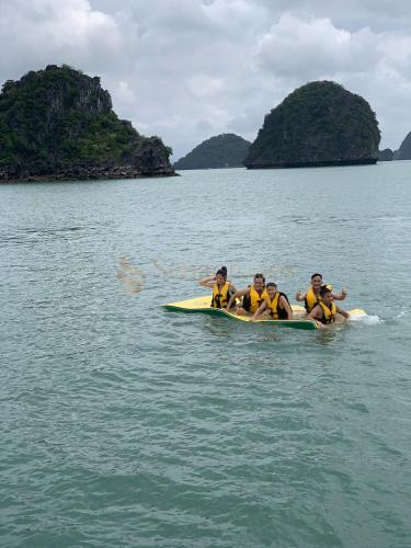 a group of people in a boat in the water at Sena Cruises - Wonder On Lan Ha Bay in Ha Long