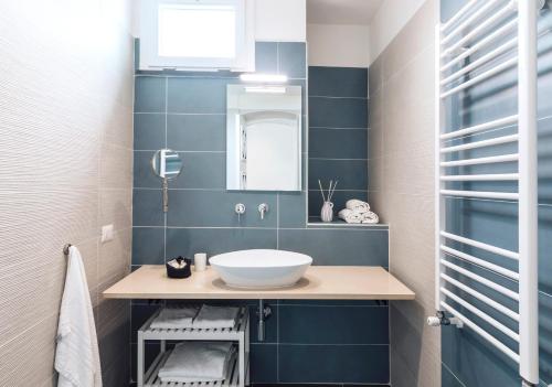 a bathroom with a sink and a mirror at Villa Livia in Ischia
