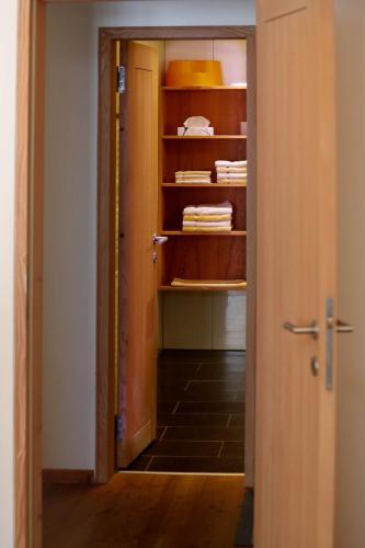 an open door to a room with a closet at Biotel Bertel Naturappartements in Brand