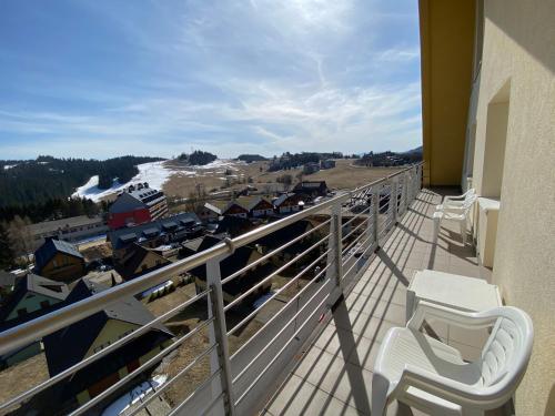 a balcony with two toilets on top of a building at The Legits Apartments in Donovaly