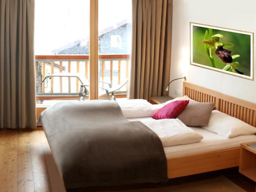 Ліжко або ліжка в номері Biotel Bertel Naturappartements