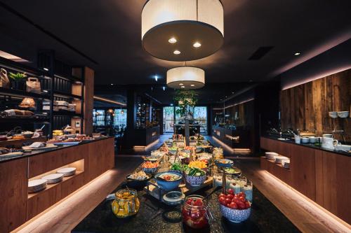 a buffet line in a restaurant with many bowls of food at Hotel Gerl in Salzburg