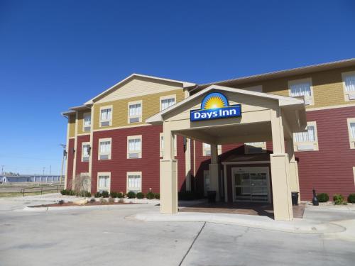 a days inn sign in front of a building at Days Inn by Wyndham Ellis in Ellis