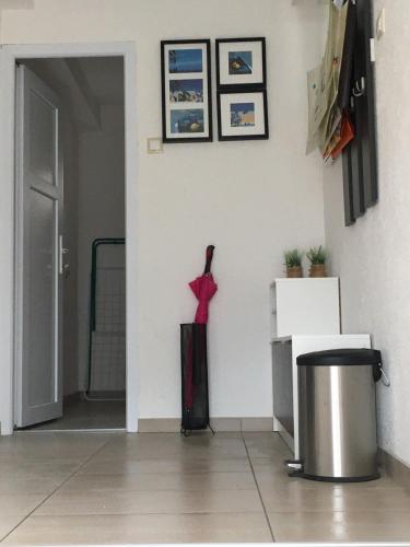 a room with a wall with a red dress on the wall at Luxury apartment in the heart of Jajce in Jajce