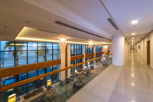 an empty lobby of a building with a view of the ocean at Boudl Al Munsiyah in Riyadh