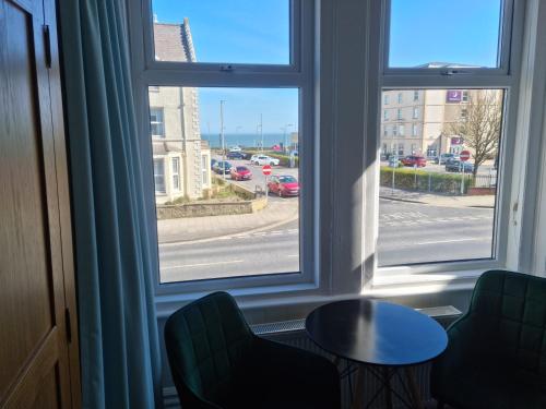 a room with a window with a view of a street at The Promenade Guest House in Bridlington