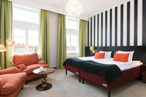 Postel nebo postele na pokoji v ubytování ProfilHotels Calmar Stadshotell