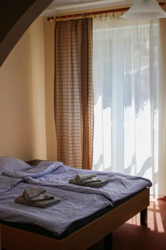 Letto o letti in una camera di Pensjonat 4 Pory roku