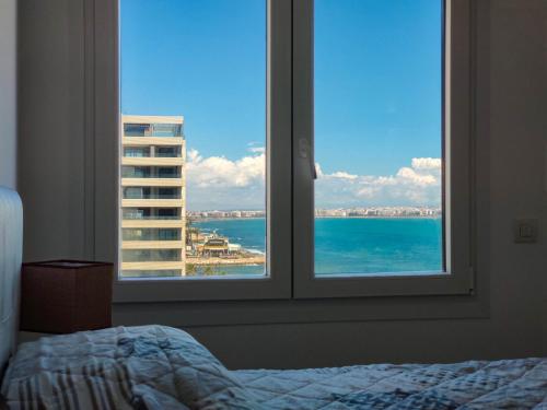 A bed or beds in a room at 213 Luxury Panorama - Alicante Holiday