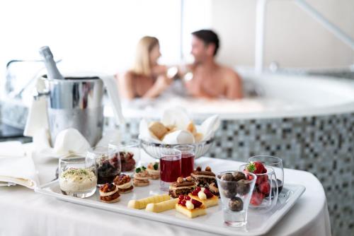 a tray of food on a table with a plate of food at Oberwaid - Das Hotel. in St. Gallen