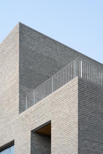 a brick building with a staircase on top of it at Laon on 37 in Tongyeong