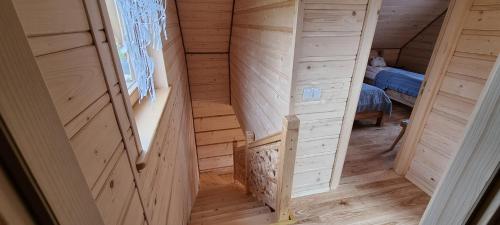 an inside view of a wooden house with a staircase at Góralski Dom z pięknymi widokami na góry in Sosnówka