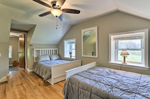 a bedroom with a bed and a ceiling fan at Idyllic Hellertown Cottage with Patio and Fire Pit! in Bethlehem