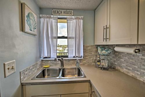 a kitchen with a sink and a window at Oceanfront Ormond Beach Getaway with Balcony! in Ormond Beach