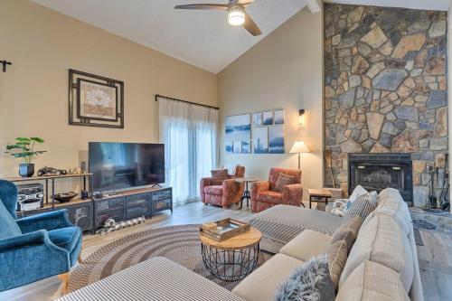 a living room with a couch and a fireplace at Pet-Friendly Massanutten Resort Home with Yard! in McGaheysville