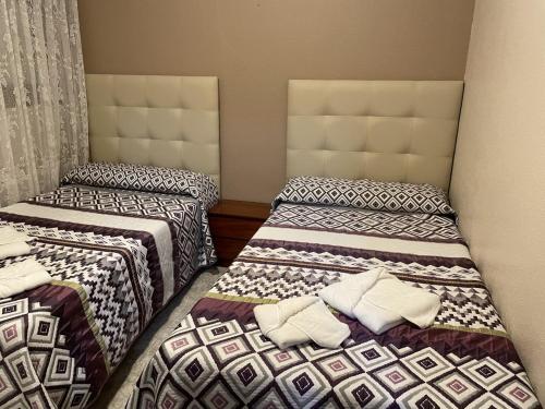 Un ou plusieurs lits dans un hébergement de l'établissement Apartamentos Gala