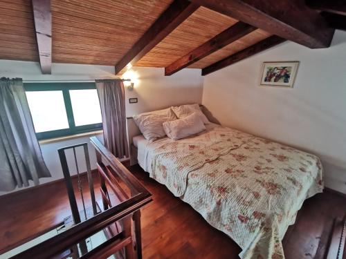 a bedroom with a bed and a window at Apartments Divina in Rovinj