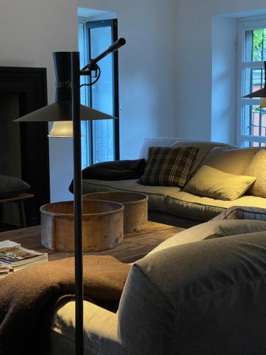 a living room with a couch and a table at Pescallo Apartments in Bellagio