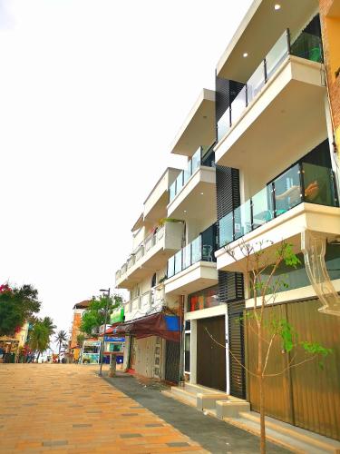 a large building with balconies on a street at Paz-2 Norte estudios in Playa del Carmen