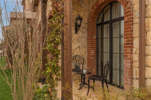 a bench sitting next to a window on a building at Bengodi Boutique Hotel in Eceabat