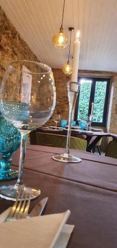 two wine glasses sitting on top of a table at Ecocasa Lema II in Muxia