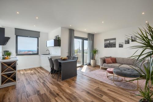 a living room with a couch and a table at Belvedere Holidays in Novigrad Istria