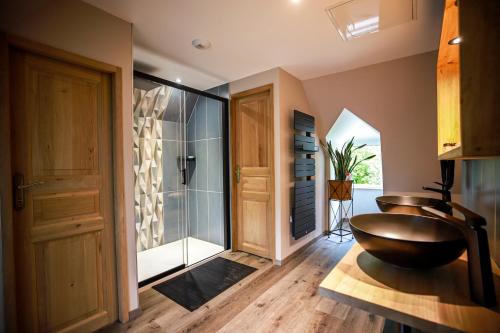 a bathroom with a bowl sink and a shower at Domaine de Monda in Argelès-Gazost