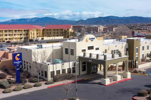 a large white building with a sign in front of it at Comfort Inn in Santa Fe
