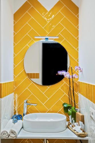 a bathroom with a sink and a mirror at La Serenata Luxury in Maiori