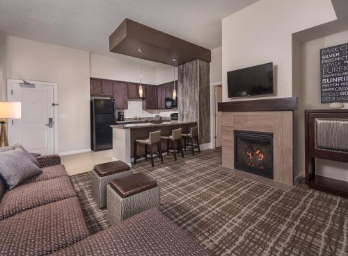a living room with a couch and a fireplace at Club Wyndham Park City in Park City