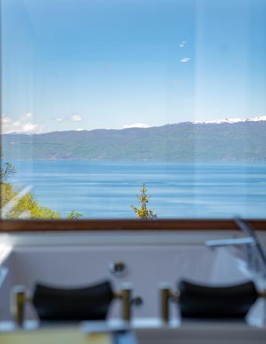 a view of a lake from a window at Apartments BRAVO in Ohrid