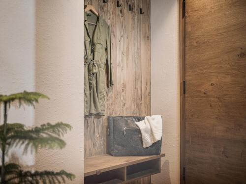 a coat hanging on a wall next to a door at Aparthotel Stacherhof in Fügen