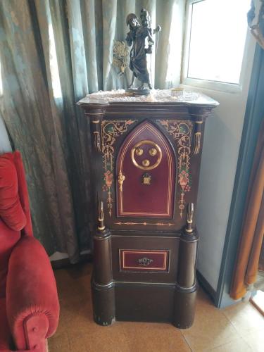 a small stove in a room with a statue on top at Forever São Brás in São Brás de Alportel