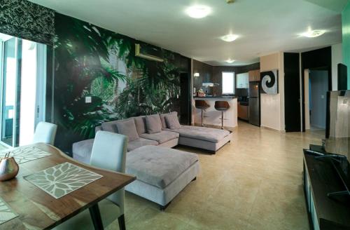 a living room with a couch and a table at BlueLagoon Apartamento en Playa Blanča in Playa Blanca