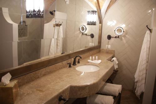 a bathroom with a sink and a mirror at Casa 1810 Hotel Boutique in San Miguel de Allende