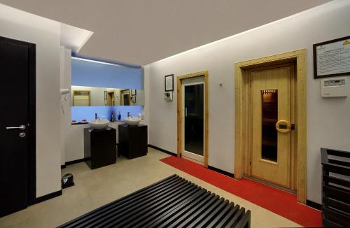 a bathroom with two sinks and two mirrors at Mayfair Spa Resort & Casino in Gangtok