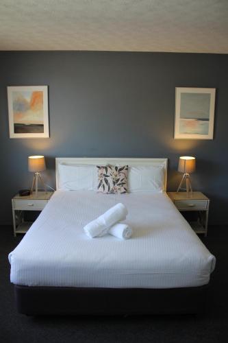 Ένα ή περισσότερα κρεβάτια σε δωμάτιο στο Hamilton Motor Inn