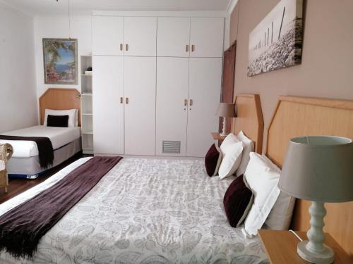 En eller flere senge i et værelse på DRIFT SANDS