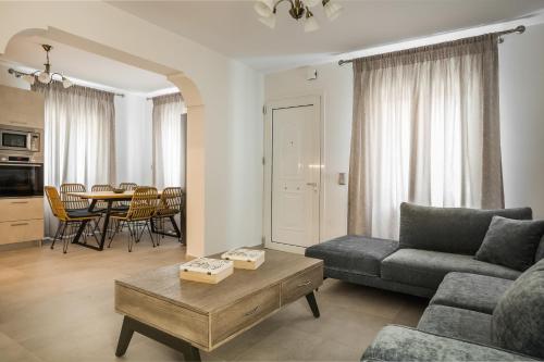 a living room with a couch and a table at Serenity Home in Argostoli