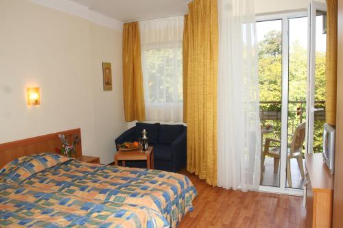 Ένα ή περισσότερα κρεβάτια σε δωμάτιο στο Joya Park Apartments