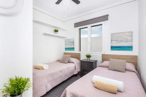 Ένα ή περισσότερα κρεβάτια σε δωμάτιο στο Villa Quimera by Villa Plus