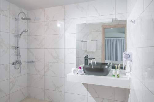 a bathroom with a sink and a shower at Golden Sunlight Hotel by Estia in Gouves