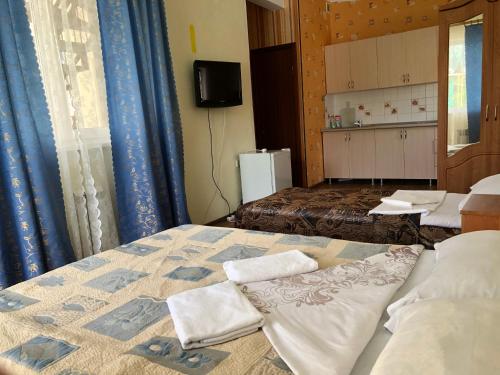 
Кровать или кровати в номере Отель Изумруд

