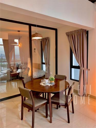 a dining room with a table and chairs at Spacious Big Room, Designed & Quiet Family Home, Eclipse in Cyberjaya by Flexihome-MY in Cyberjaya
