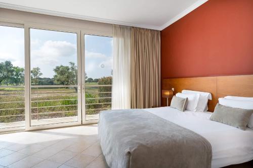 A bed or beds in a room at Montado Hotel & Golf Resort