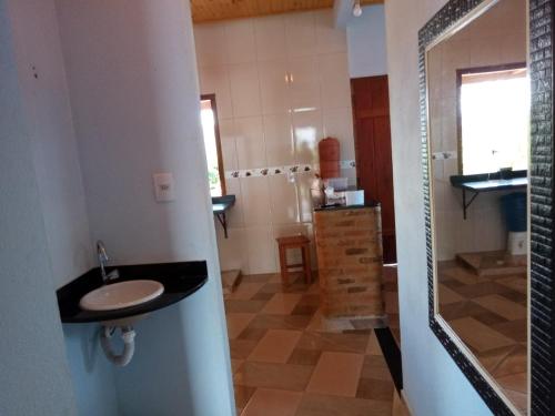 a bathroom with a sink and a shower at casa bela vista in Milho Verde